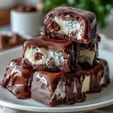 Pastel Chocolate Bark with Cadbury Eggs featuring colorful swirls of white and candy melts topped with crunchy mini eggs and sprinkles.