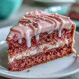Elegant pink velvet cake, kissed with rosé, perfect for celebrations.