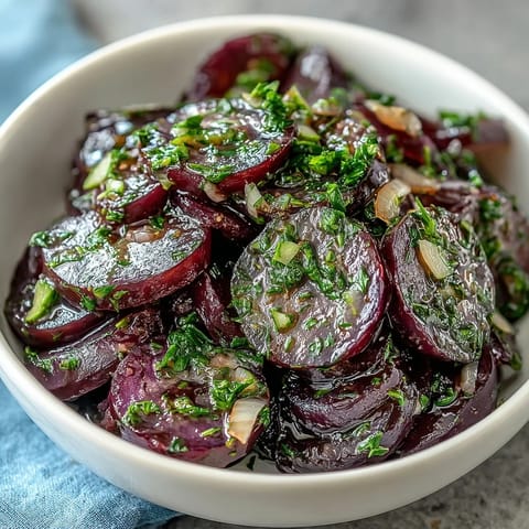 Refreshing cucumber radish salad with dill vinaigrette, featuring thin slices of cucumber and radish drizzled with a tangy, honey-mustard herb dressing.