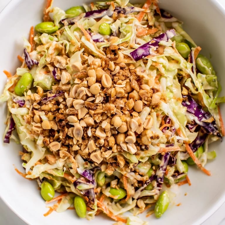 Colorful Crunchy Thai Peanut Salad with red bell pepper and scallions, served chilled as a healthy vegetarian side dish.