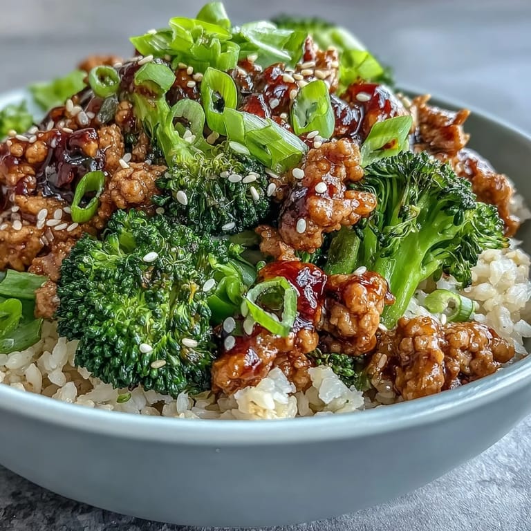 Sweet and Spicy Turkey Broccoli Bowls with saucy ground turkey and bright green steamed broccoli over rice.