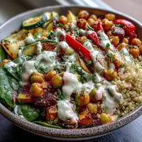 A close-up of the Roasted Chickpea Power Bowl with crispy chickpeas and avocado slices on quinoa.
