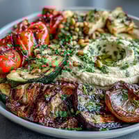 Grilled Veggie Platter with Hummus features colorful vegetables charred to perfection alongside creamy, homemade hummus.  